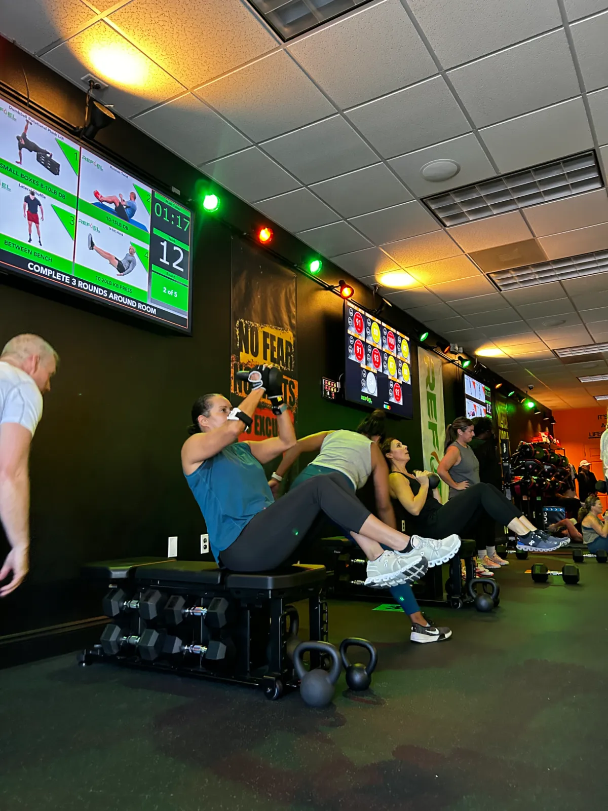 Group class working through a circuit on benches